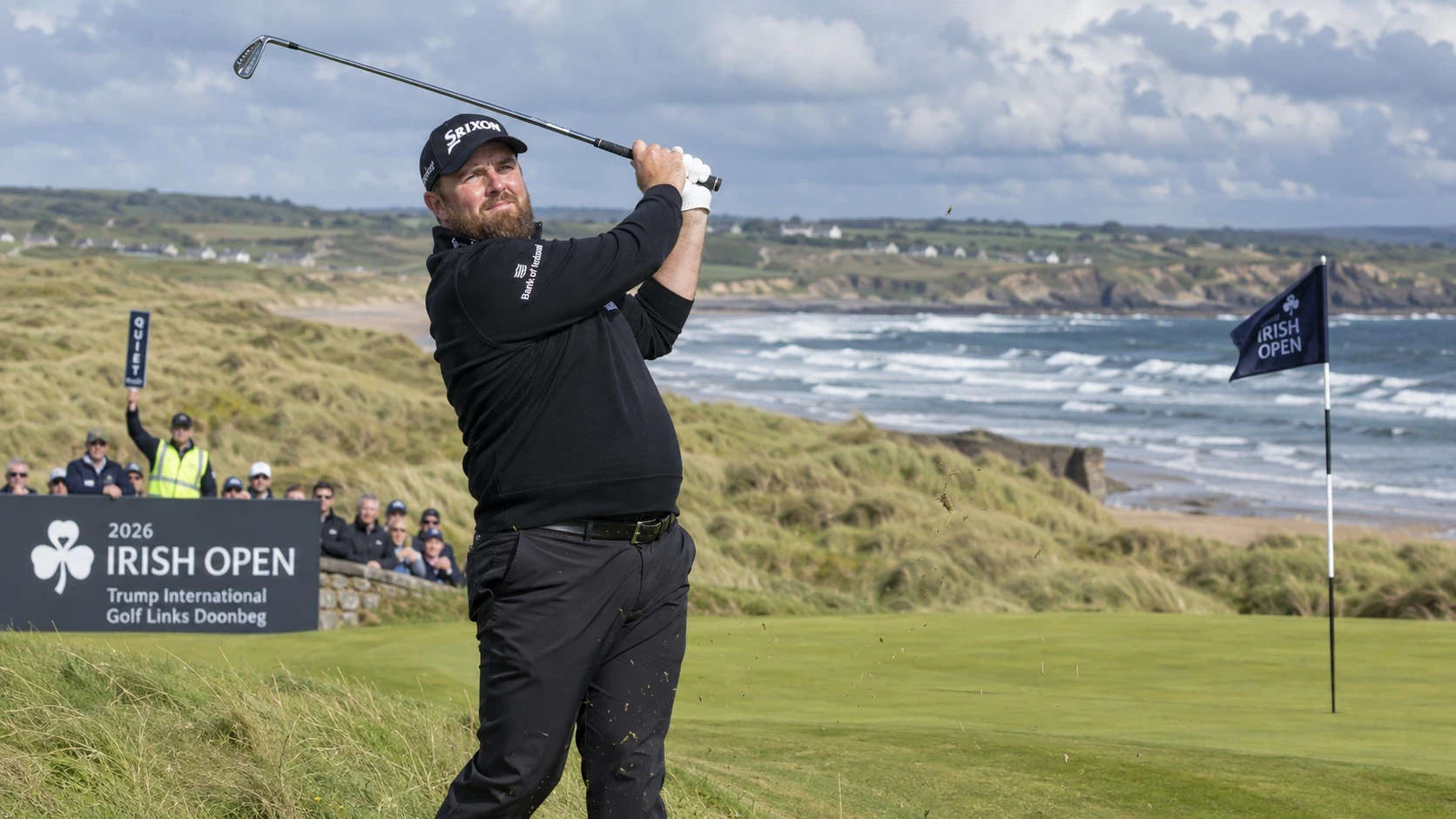 Shane Lowry swings on the 18th green at Trump International Golf Links Doonbeg during the 2026 Irish Open