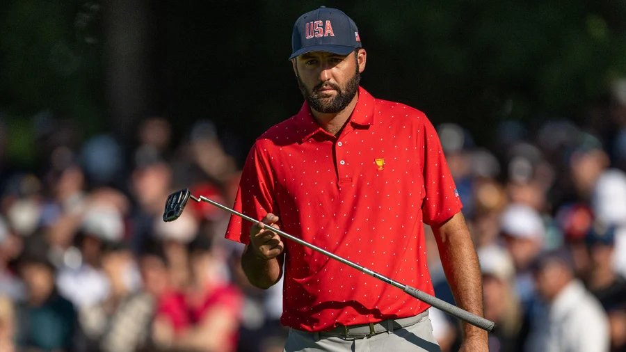 Scottie Scheffler addresses his ball during a tournament round. He topped the 2026 U.S. Presidents Cup standings.