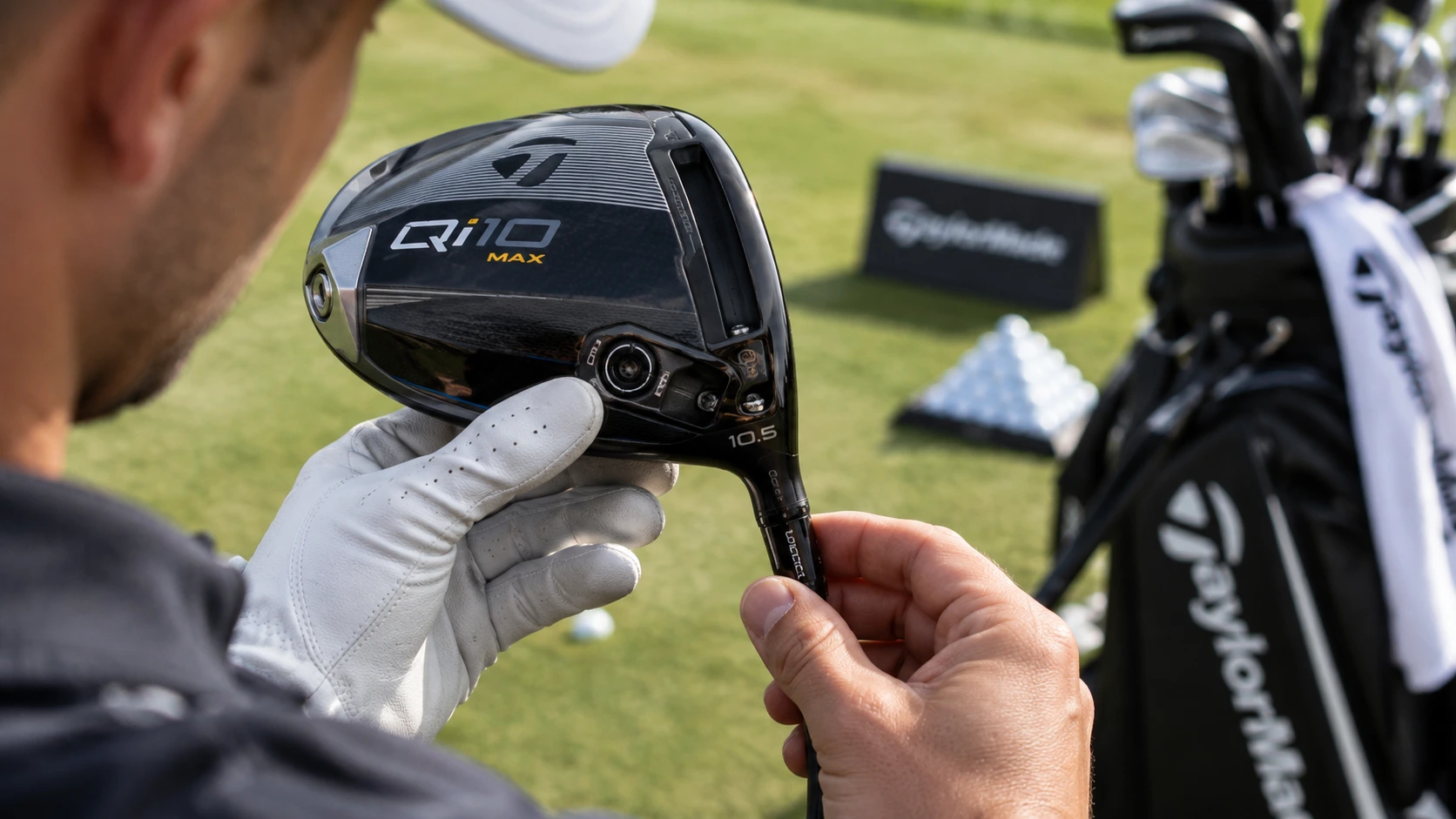 Golfer inspecting driver head markings and loft settings before buying discounted golf clubs