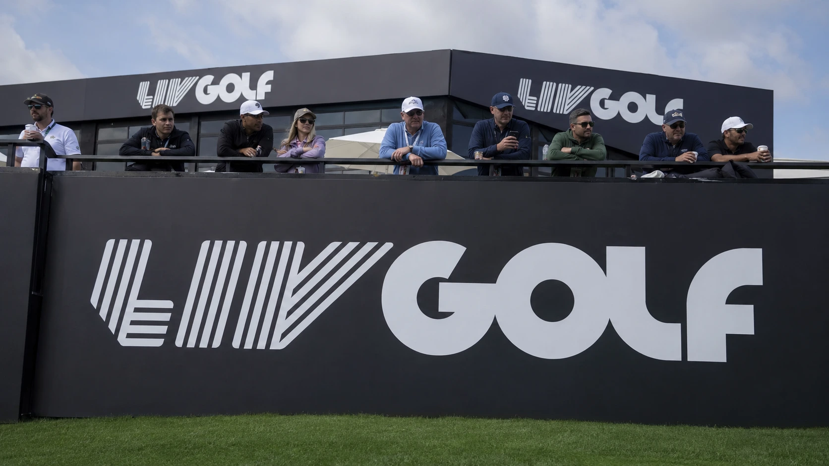 LIV Golf sign on a golf course.
